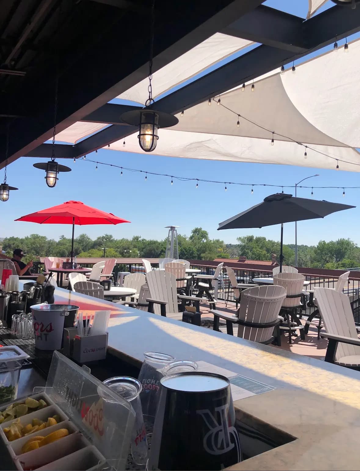 Rooftop patio seating with mountain views at Whitewater Rooftop Social